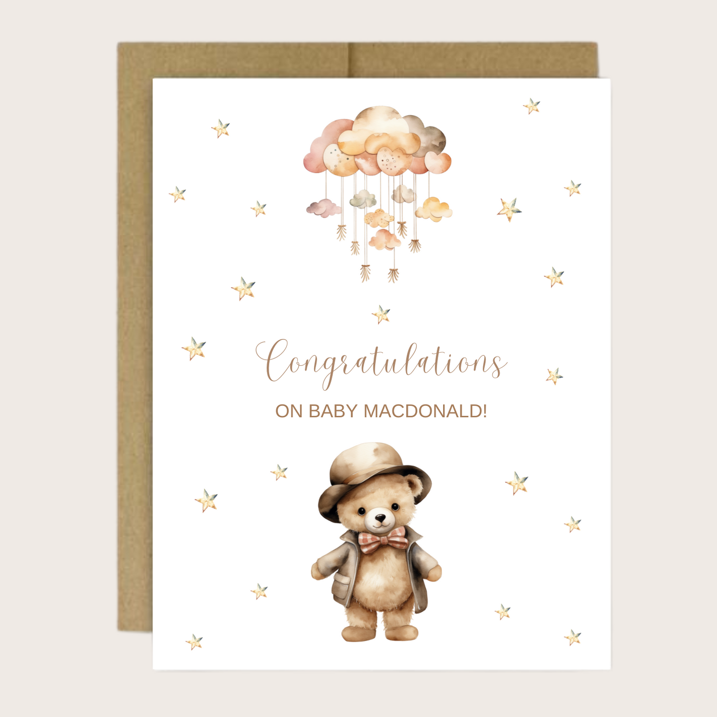 New baby card with brown teddy bear, baby mobile and stars.