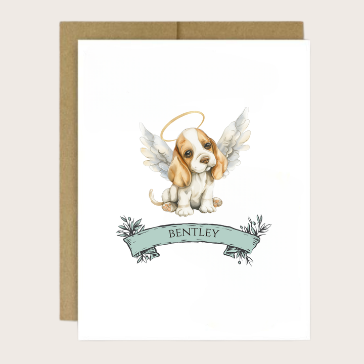 A greeting card of a Basset Hound puppy with halo and wings and personalized name.