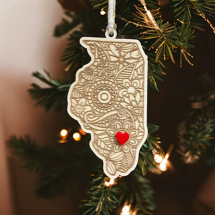 Wooden Illinois ornament with white and gold ribbon and red heart.