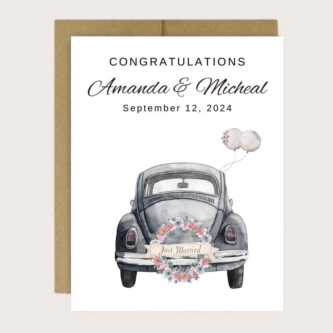 A greeting card with a grey car and just married license plate.