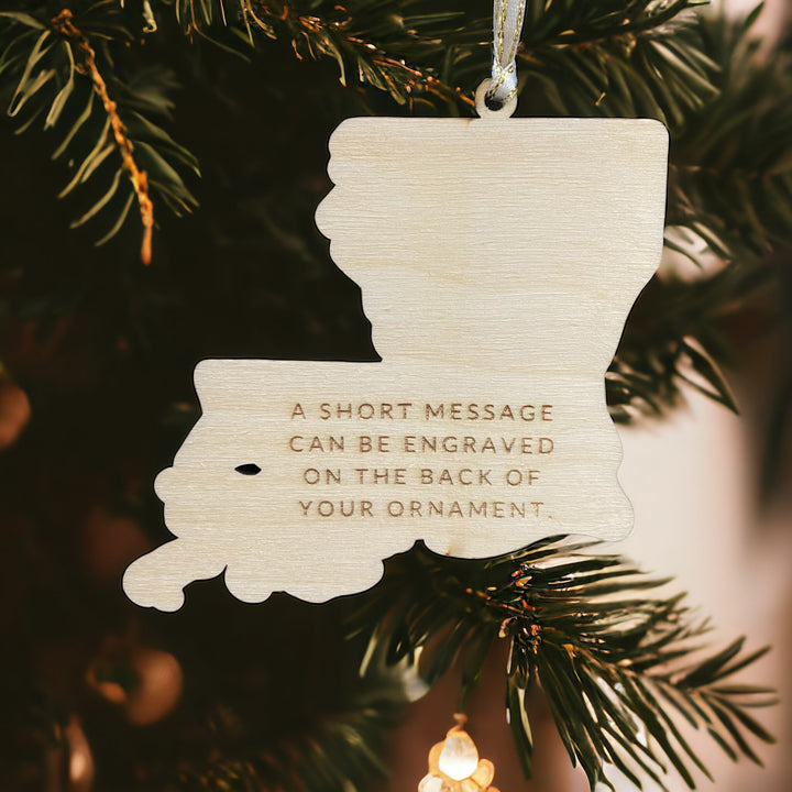 Wooden laser-engraved Louisiana ornament with engraving on the back.