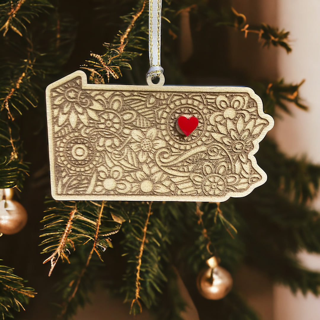  Wooden Pennsylvania ornament with white and gold ribbon and red heart.