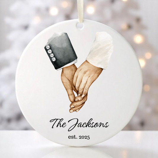 Ornament with a groom and bride holding hands.