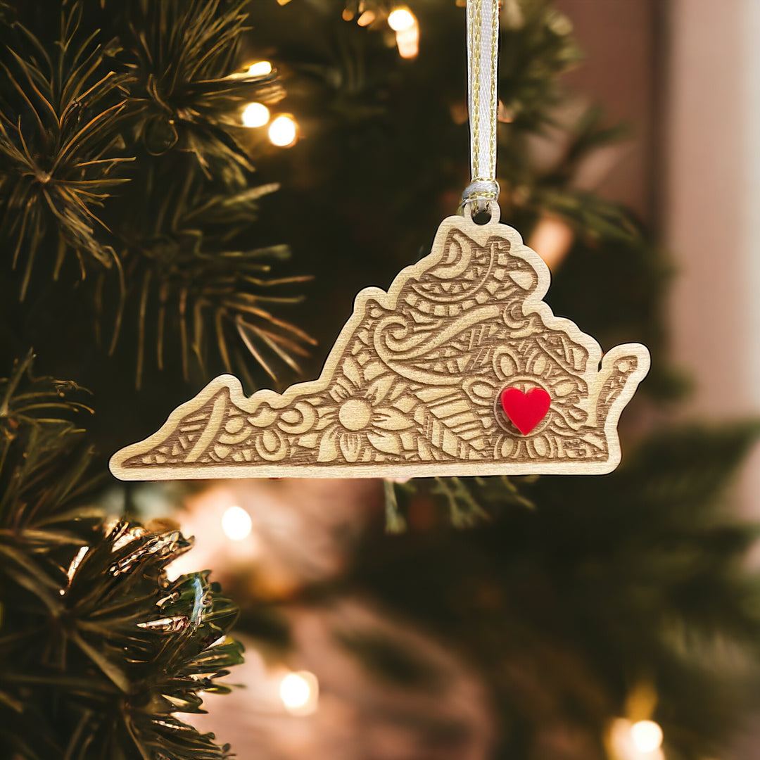 Wooden Virginia ornament with white and gold ribbon and red heart.