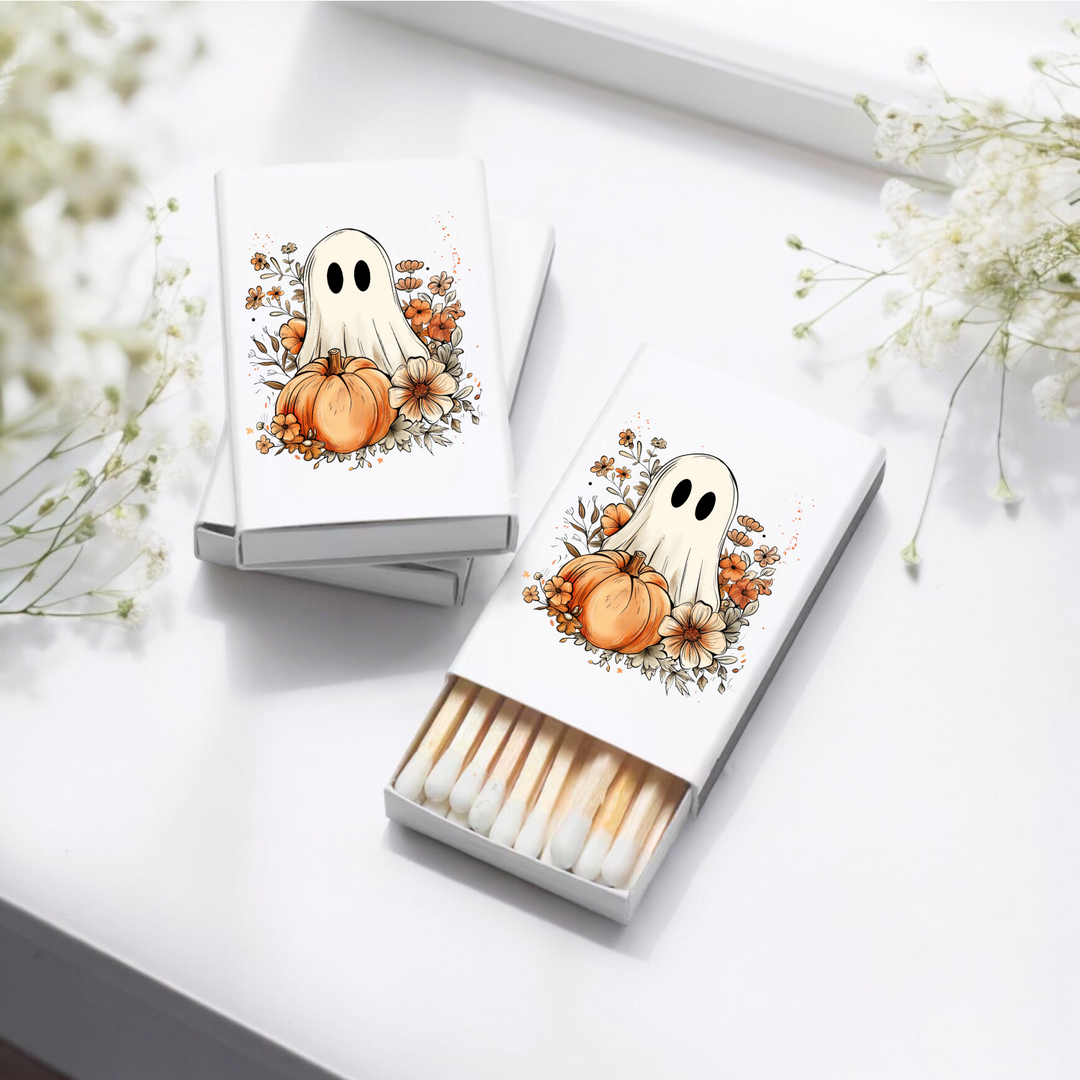 Matchboxes with a ghost and floral pumpkin design.