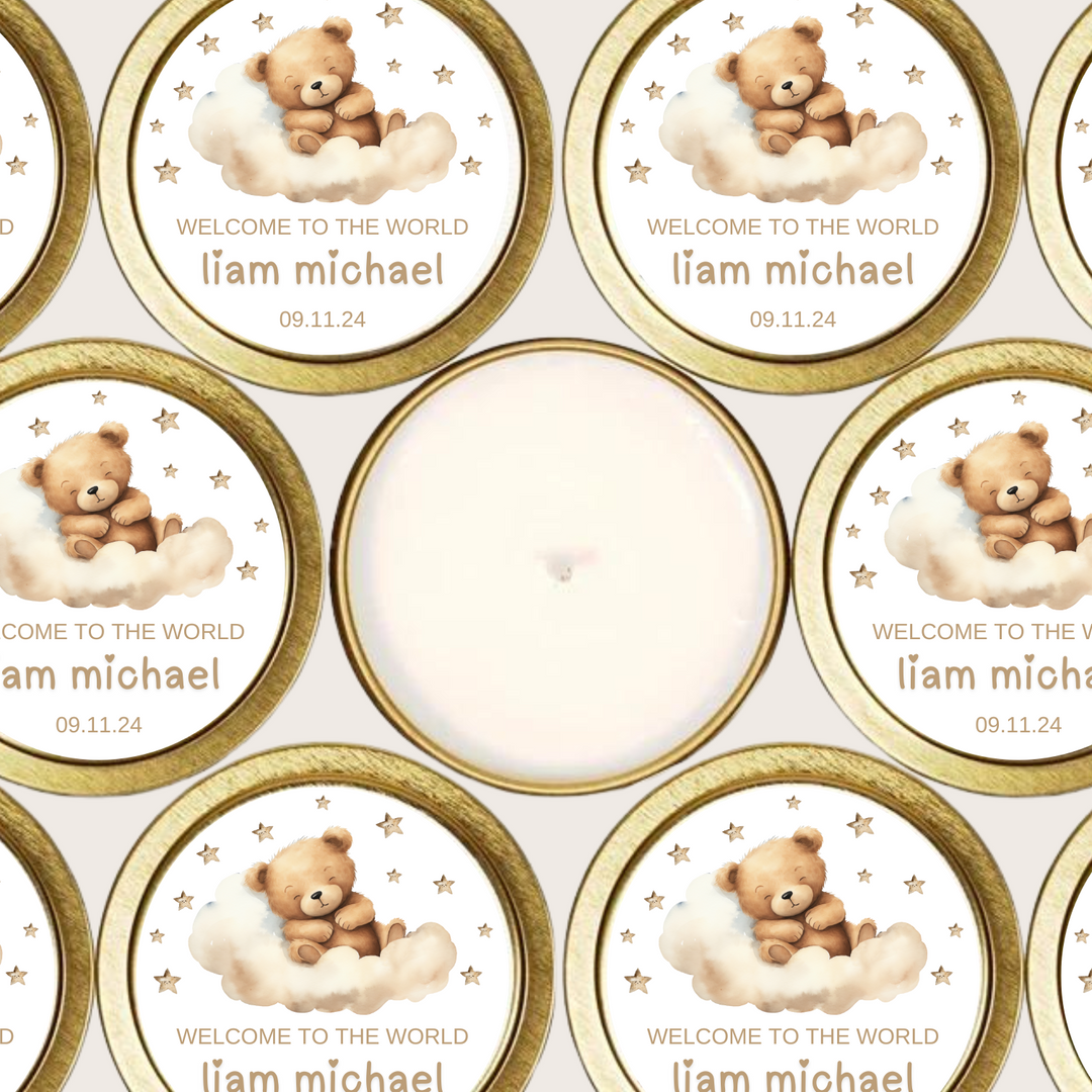 Gold tin candles with personalized labels of a sleepy bear on a brown cloud.