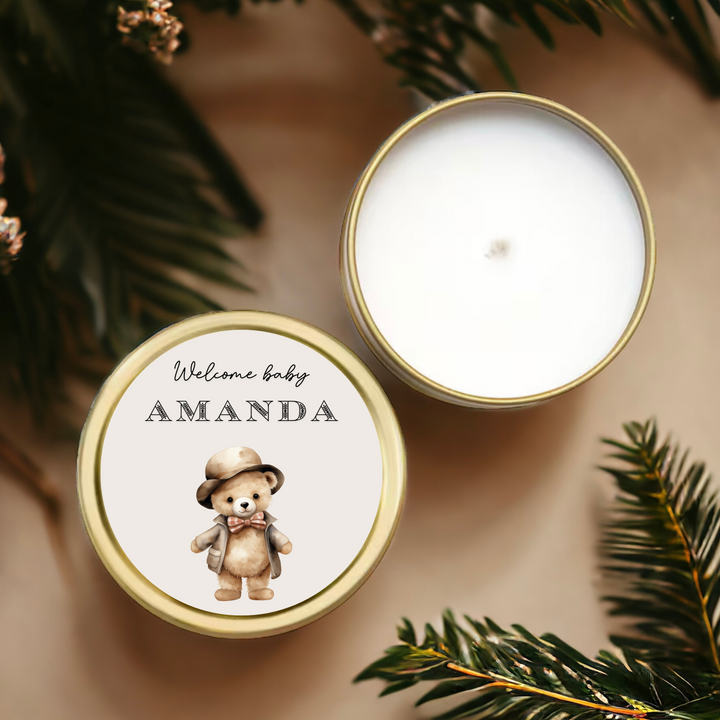 A gold tin candle with a soft tan background, teddy bear and personalized label.