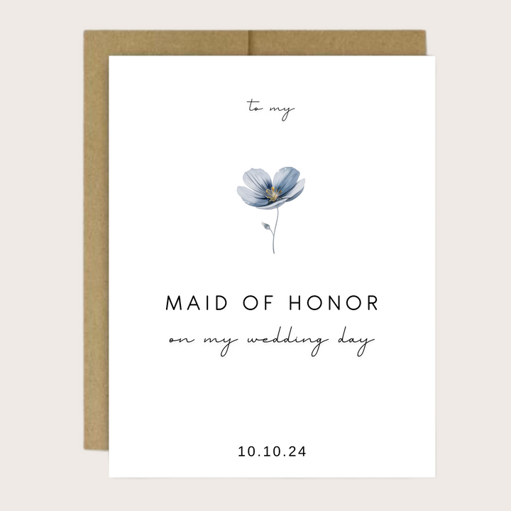 A greeting card with a blue flower and personalized thank you bridal party sentiment.