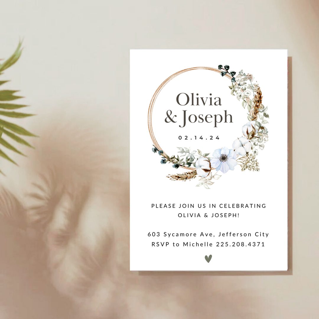 Personalized invitation with boho floral wreath design.