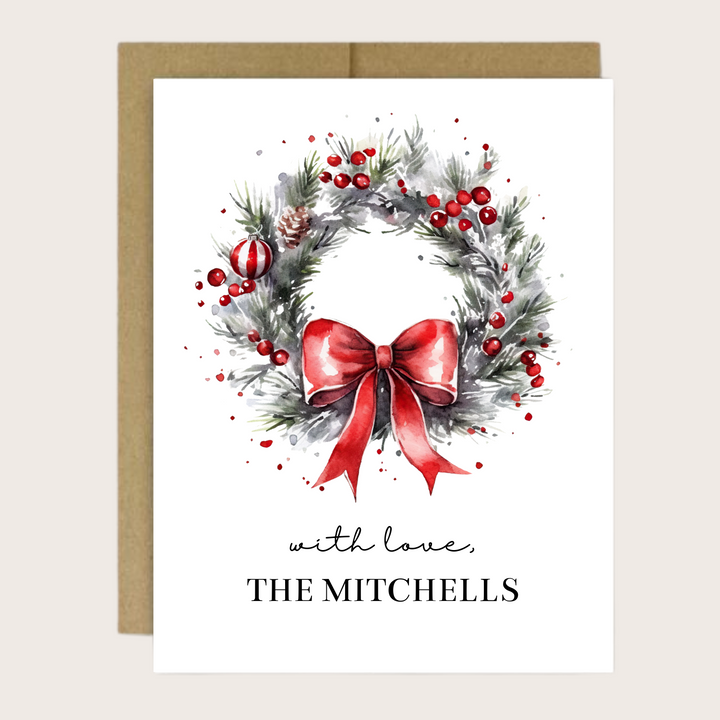 A Christmas greeting card with a watercolor wreath.