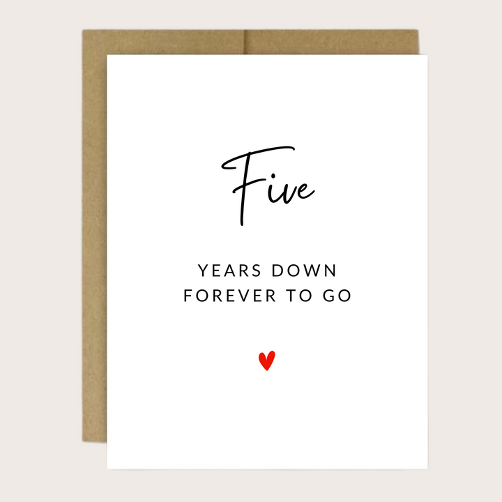 A greeting card with "Five years down, forever to go" with a small red heart.