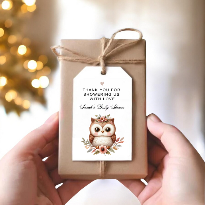 A small gift box with a personalized label and a floral owl design