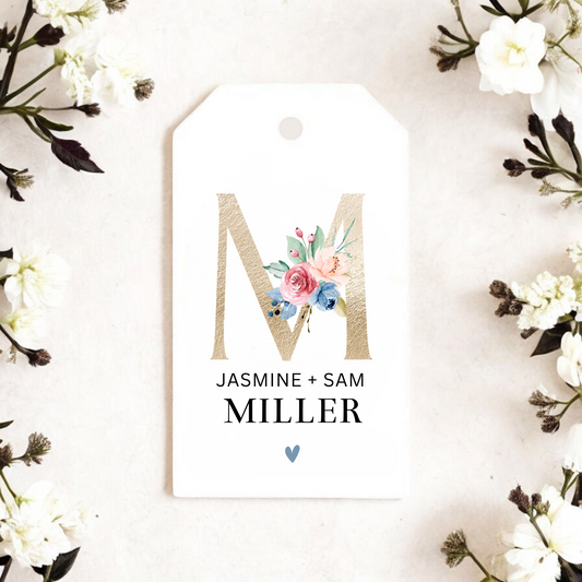 Gift tag with gold initial.