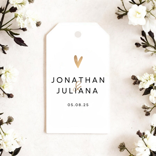 White gift tag with gold heart, couple's names and event date.