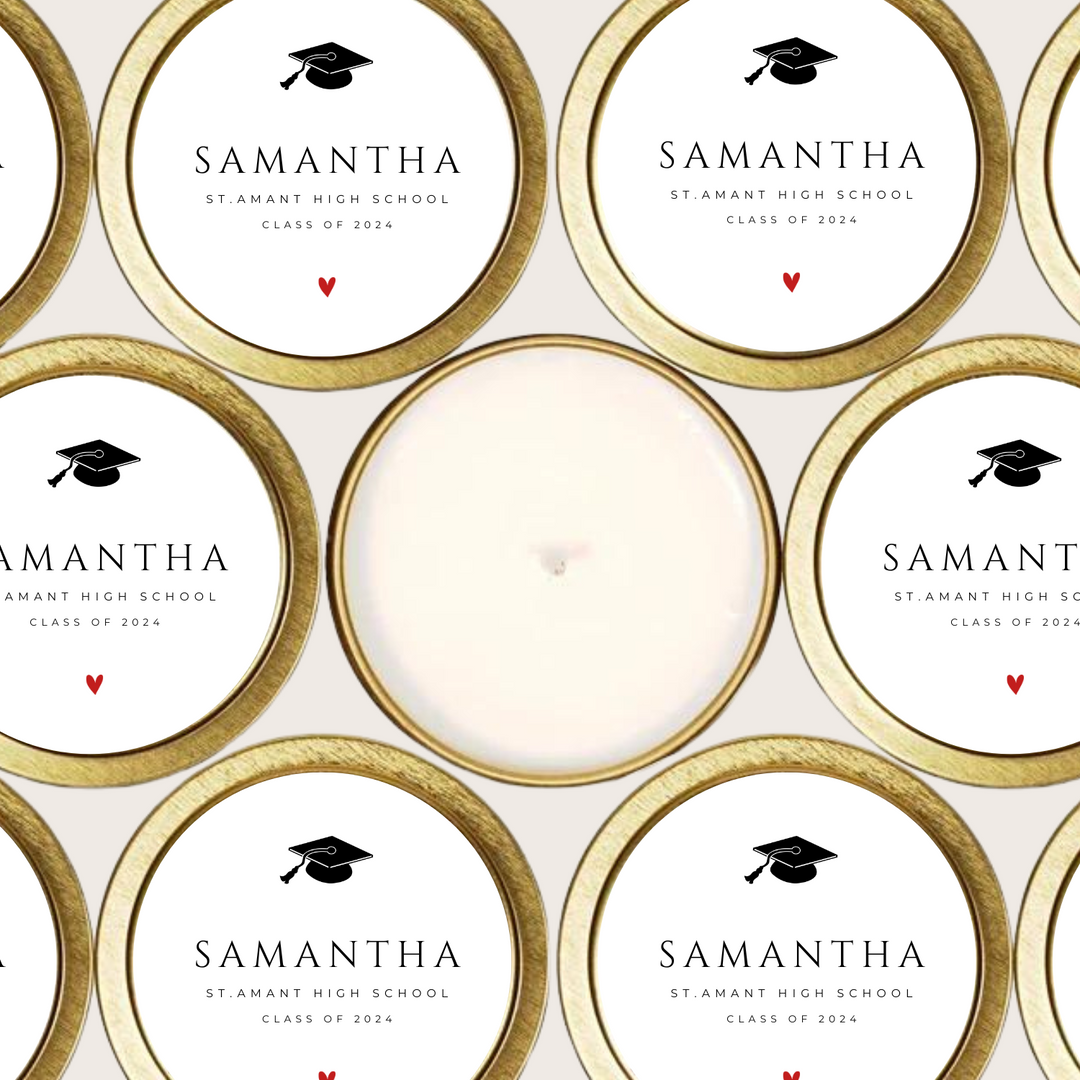 Gold tin candles with a graduation cap and the graduate's name, school and graduation year.