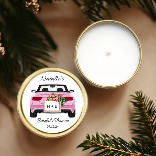 Gold tin candle with a pink convertible car label personalized with the bride's name.