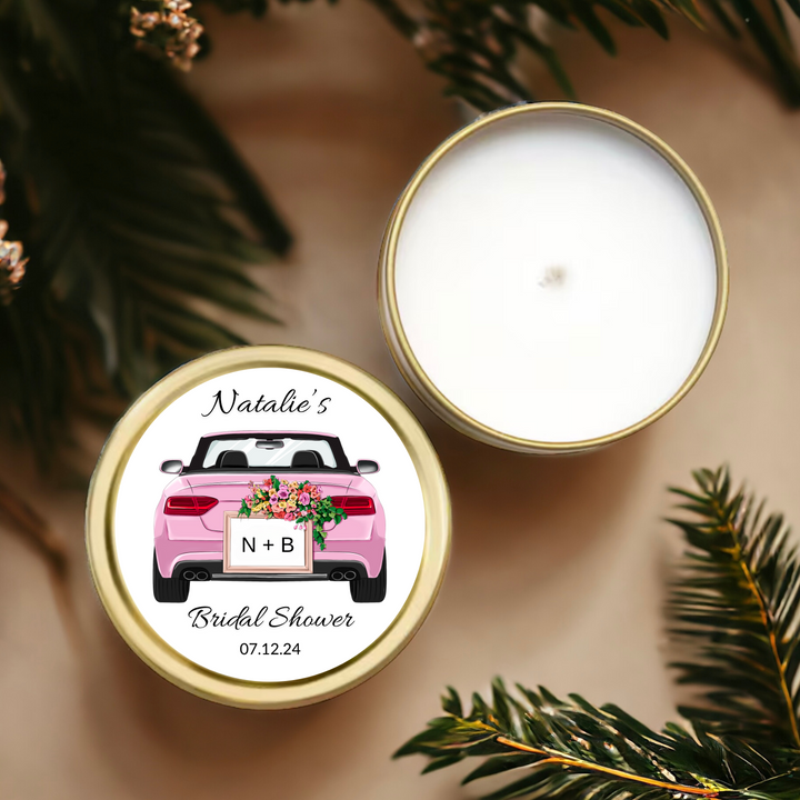 Gold tin candle with a pink convertible car label personalized with the bride's name.