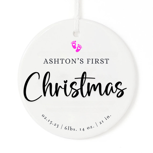 A white Christmas ornament keepsake with personalized baby name and birth stats. The ornament has baby feet you choose the color.