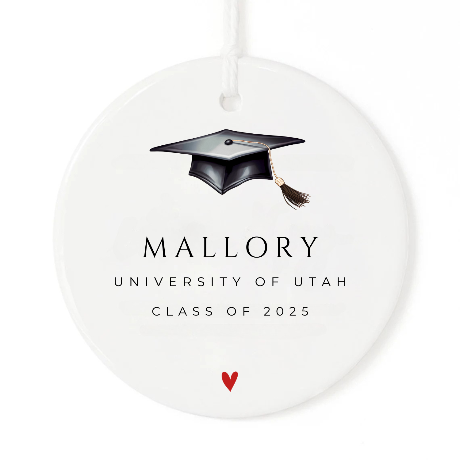 A Christmas ornament with a graduation cap personalized with a name, school name and class year.