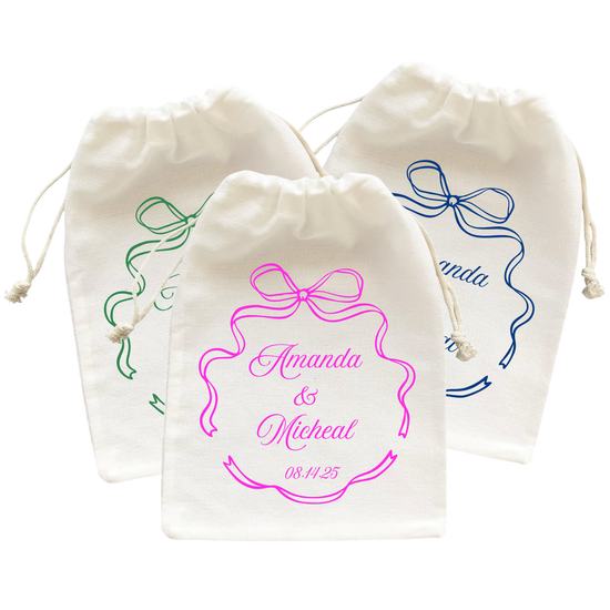 Three small wedding favor bags with colorful bow and personalized message.