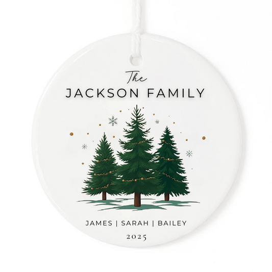 A white Christmas ornament keepsake gift with three Christmas trees, family names and date.