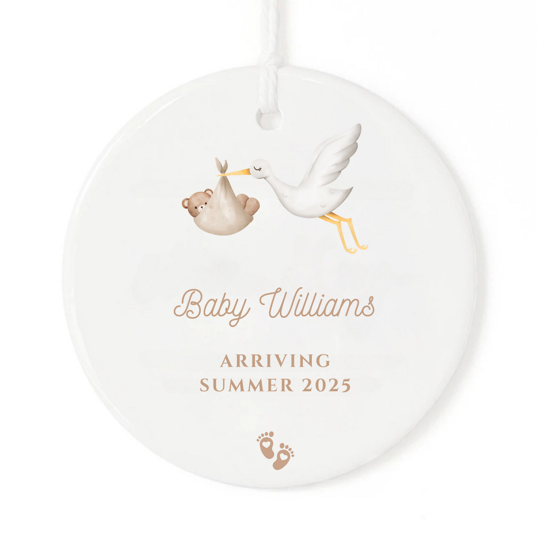 A personalized pregnancy announcement ornament gift.