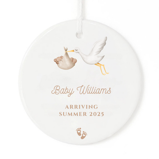 A personalized pregnancy announcement ornament gift.