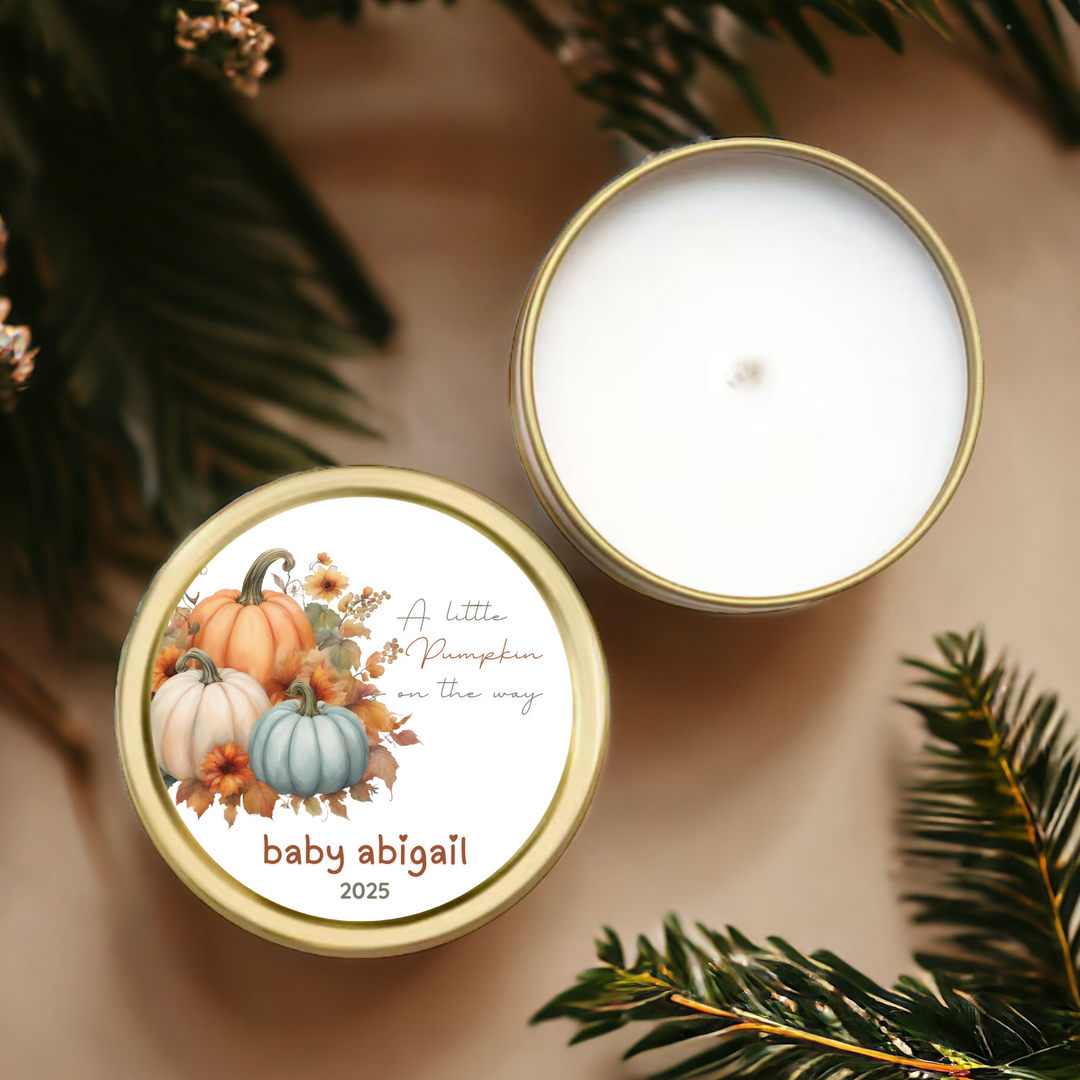 A gold tin candle with a label of pumpkins and a little pumpkin is on the way.