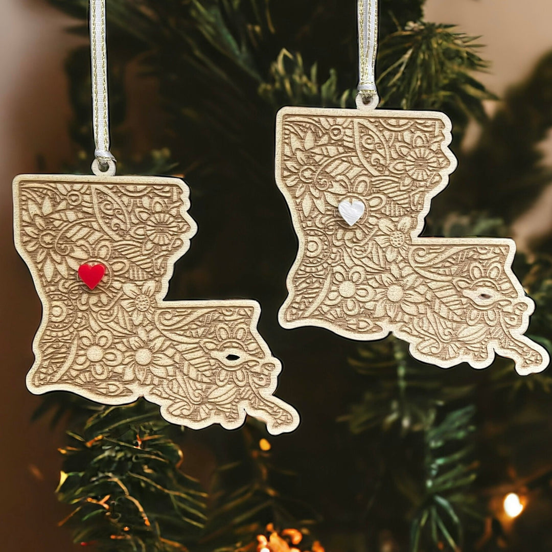 Two wooden Louisiana ornaments.