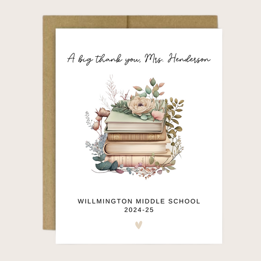 A greeting cards with a floral book design and the teacher's name, school and year.