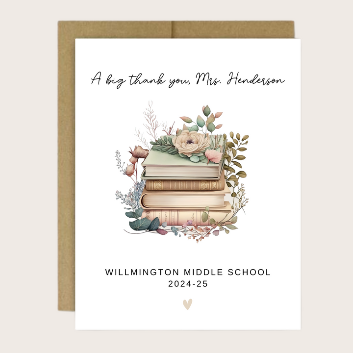 A greeting cards with a floral book design and the teacher's name, school and year.