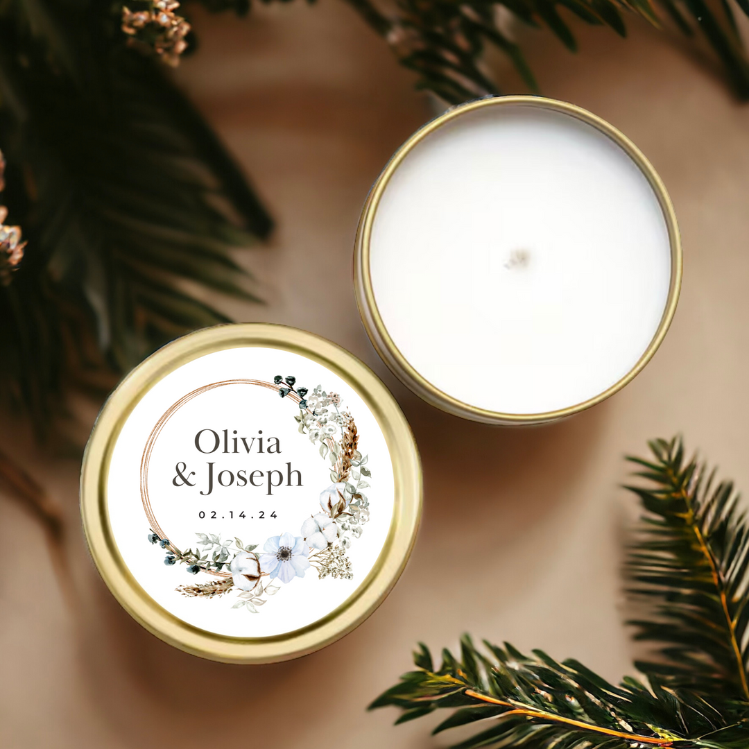 Gold tin candle with personalized floral wreath label.